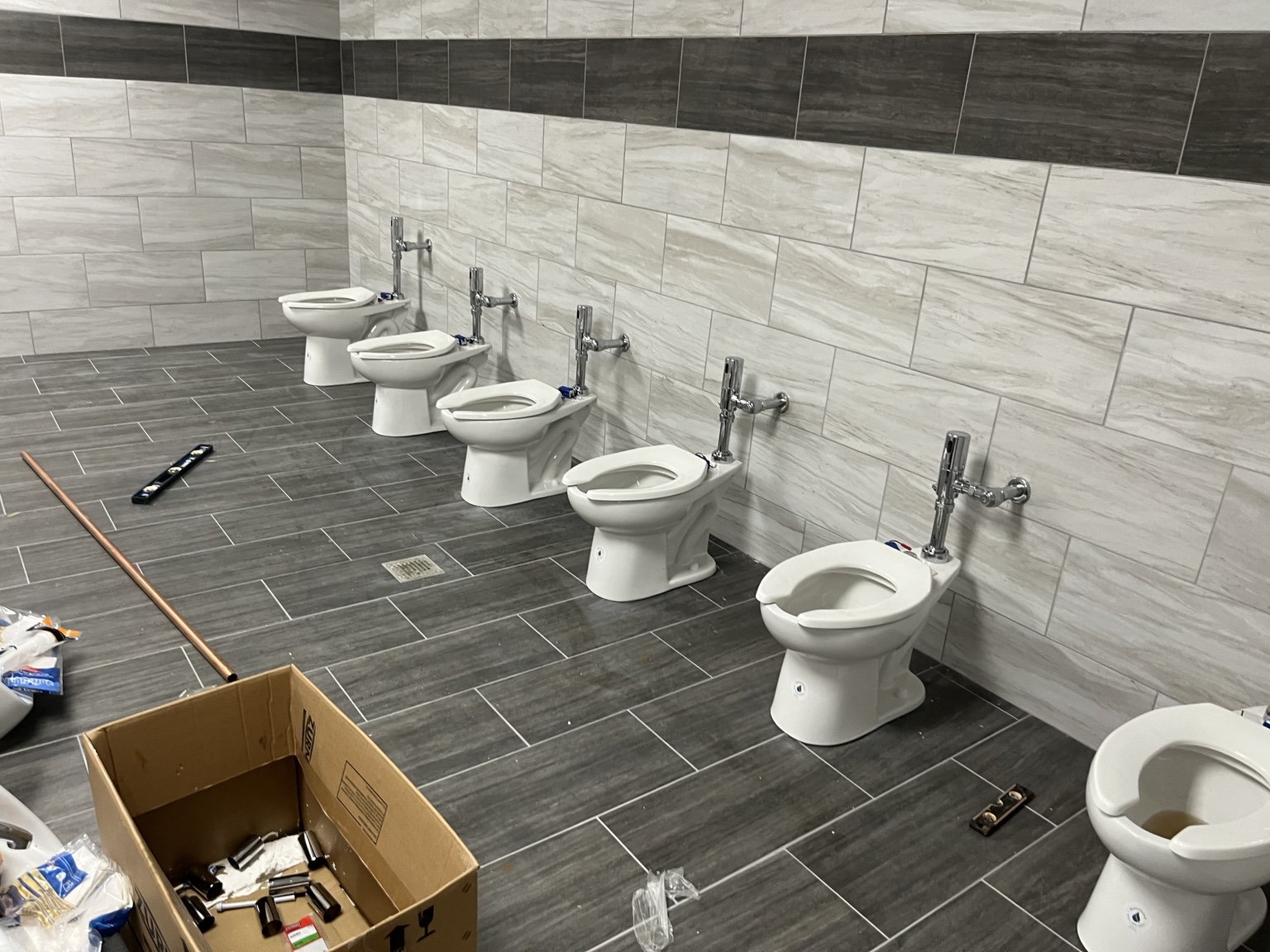 Commercial restroom fixture installation by DHS Plumbing, view 2