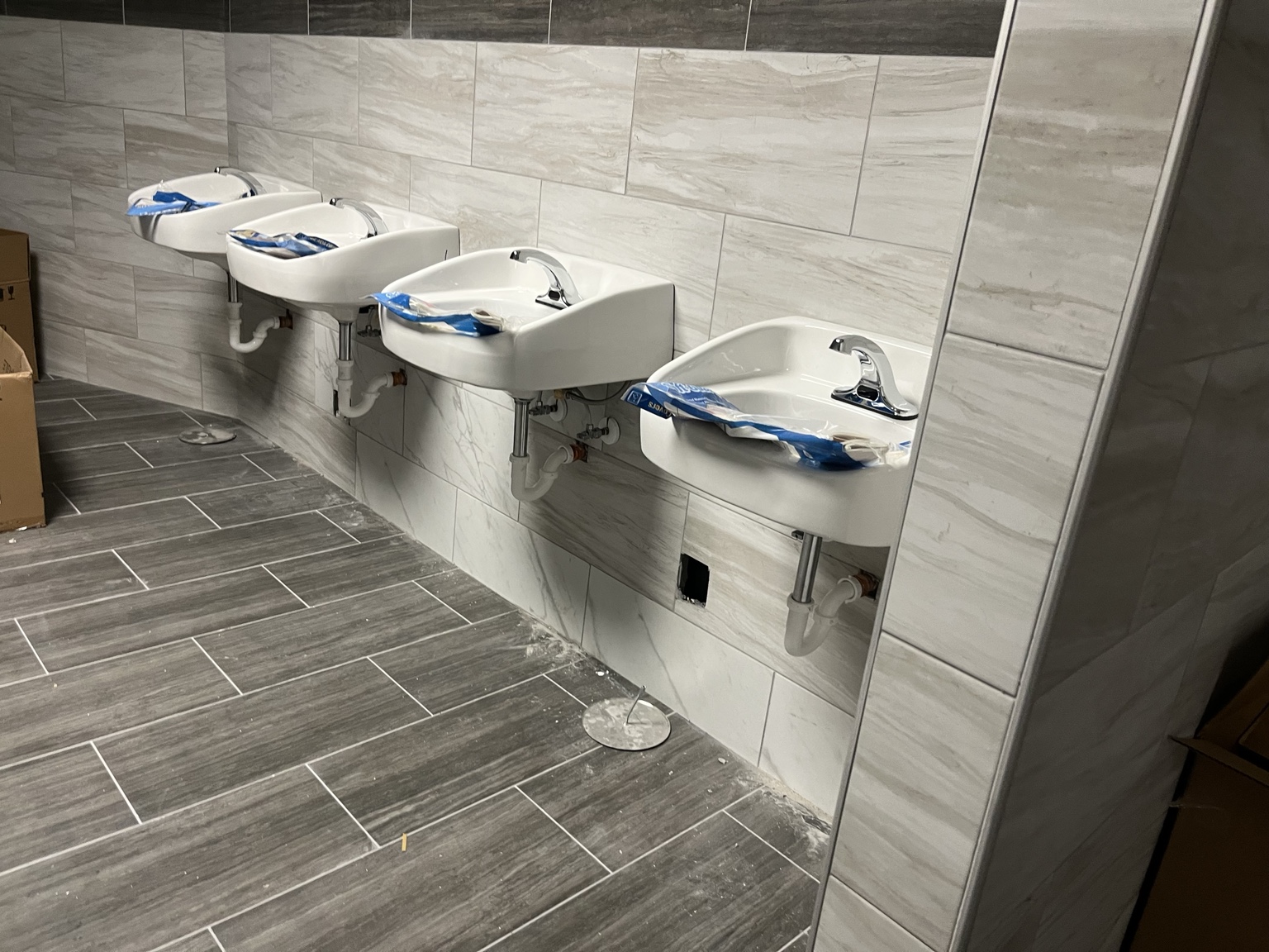 Commercial restroom fixture installation by DHS Plumbing, view 4